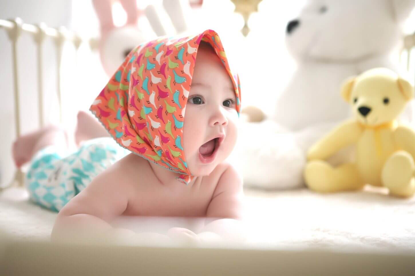 toddler-wearing-head-scarf-in-bed